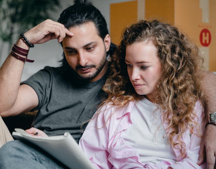 Man and woman looking at documents