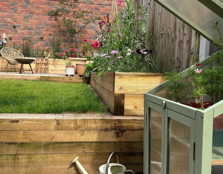 Rear garden with greenhouse